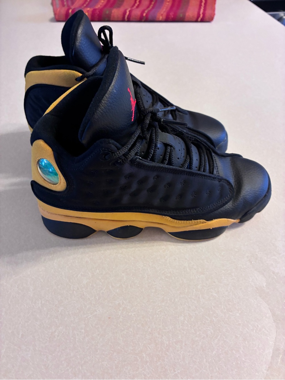 Jordan Kids Black and Gold High-Top Sneakers
